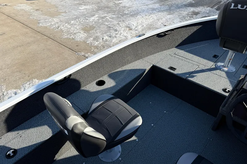 Slide: The Image of 2026 Lund 1650 Rebel XL SS boat interior with seating and storage compartments. - 17