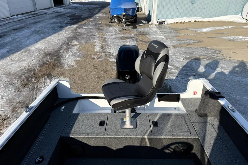 Slide: The Image of 2026 Lund 1650 Rebel XL SS boat interior with a single swivel seat. - 19