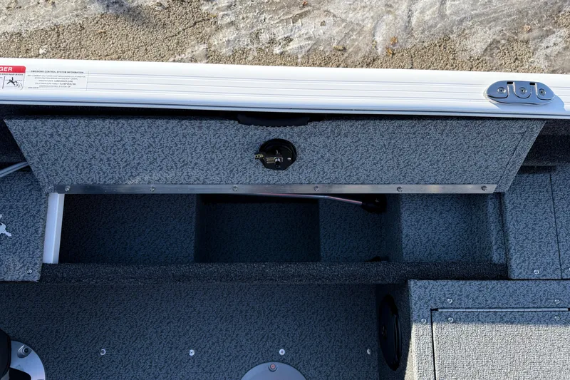 Slide: The Image of Interior view of 2026 Lund 1650 Rebel XL SS boat storage compartment. - 20