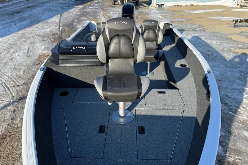 Slide: The Image of 2026 Lund 1650 Rebel XL SS boat interior with seating and storage compartments. - 8