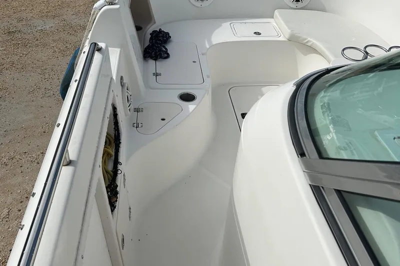 Slide: The Image of 2004 Hurricane SD 260 boat interior with seating and storage compartments. - 6