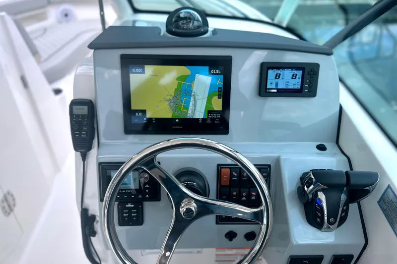 Slide: The Image of 2023 Pursuit DC 266 Dual Console dashboard with navigation and control systems. - 19