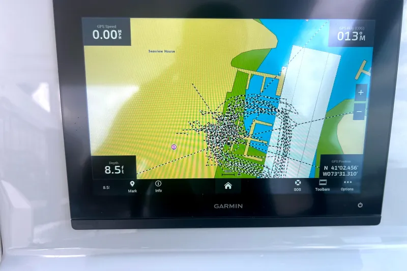 Slide: The Image of Garmin navigation display on 2023 Pursuit DC 266 Dual Console boat, showing map and depth. - 20