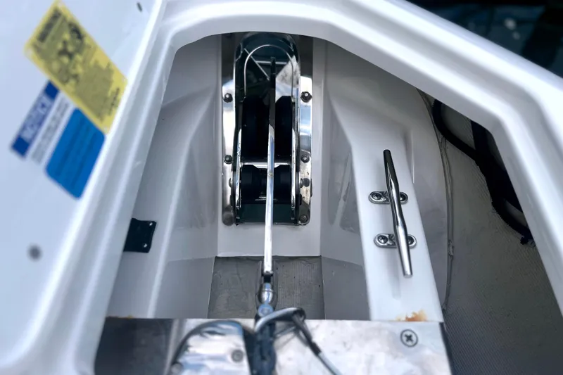 Slide: The Image of 2023 Pursuit DC 266 Dual Console boat anchor compartment with stainless steel fittings. - 29