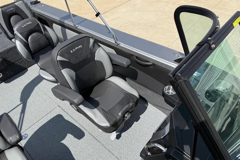 Slide: The Image of Interior of 2026 Lund 1975 Tyee boat with comfortable seating and modern design. - 13