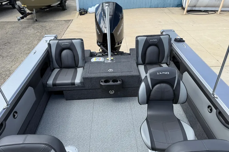 Slide: The Image of 2026 Lund 1975 Tyee boat interior with gray seating and modern design. - 26