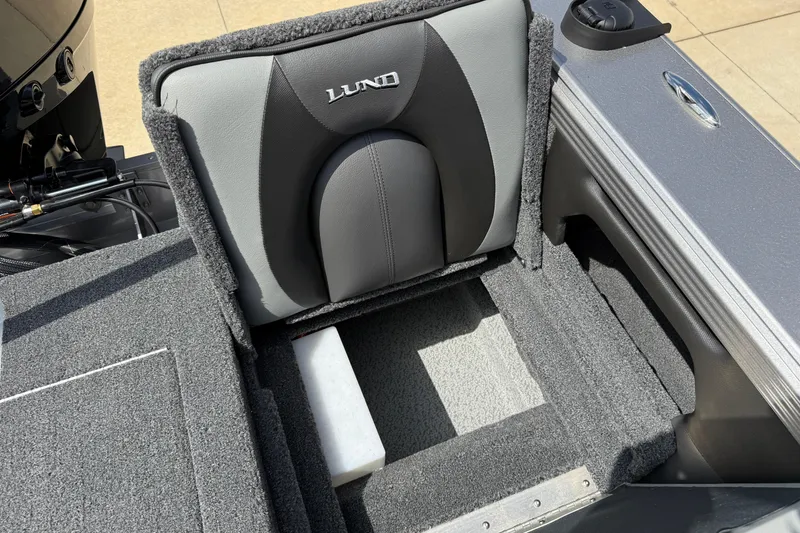 Slide: The Image of Interior of 2026 Lund 1975 Tyee boat with gray cushioned seating. - 32