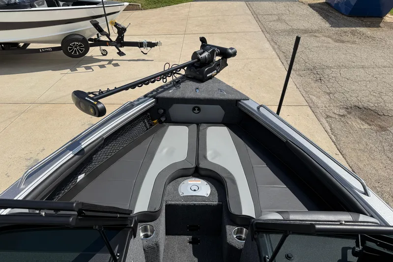 Slide: The Image of 2026 Lund 1975 Tyee boat interior with trolling motor and seating area. - 9