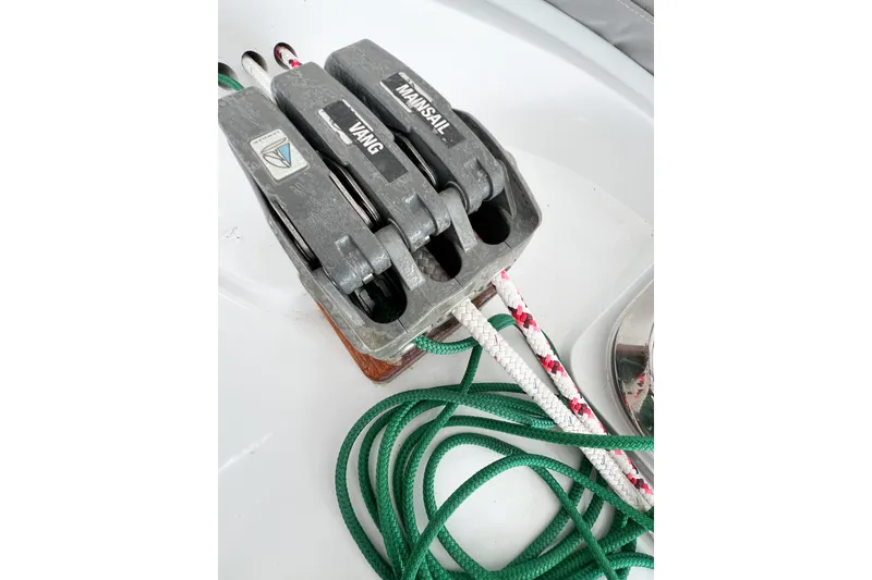 Slide: The Image of Sailing equipment on a 1984 Trintella 42 yacht, featuring rope clutches and colorful lines. - 19
