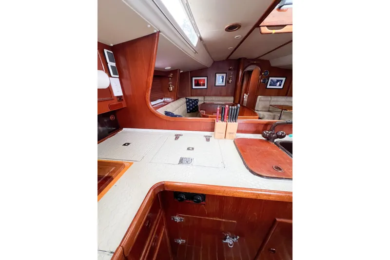 Slide: The Image of Interior of 1984 Trintella 42 yacht with wooden cabinetry and modern amenities. - 26