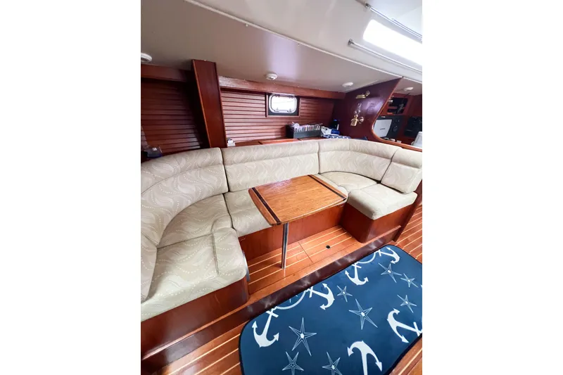 Slide: The Image of Luxurious interior of 1984 Trintella 42 yacht with elegant seating and wooden finishes. - 30