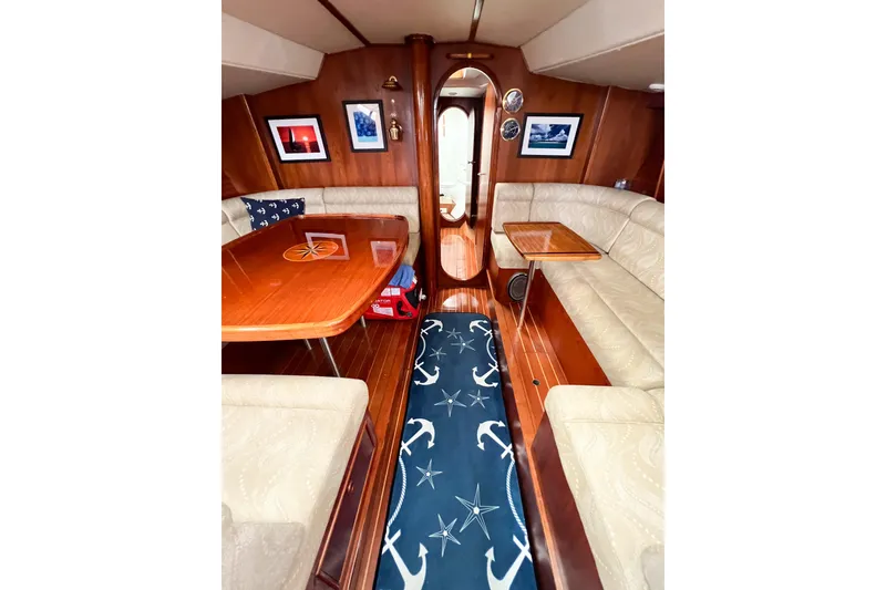 Slide: The Image of Luxurious 1984 Trintella 42 yacht interior with elegant wood finishes and nautical decor. - 35