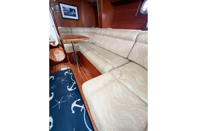 Slide: The Image of Interior of 1984 Trintella 42 yacht with elegant beige seating and nautical decor. - 36