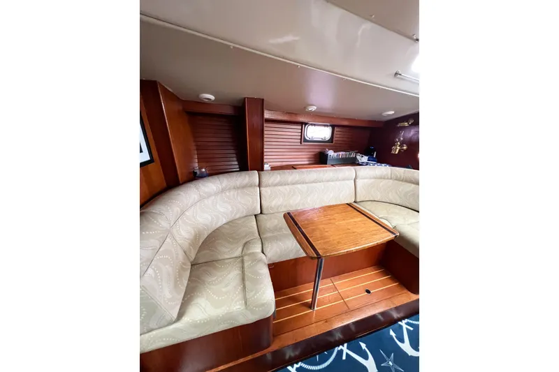 Slide: The Image of Interior of 1984 Trintella 42 yacht with cozy seating and wooden table. - 39