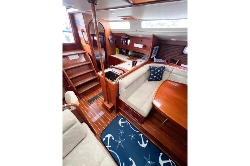 Slide: The Image of Luxurious 1984 Trintella 42 yacht interior with elegant wood finish and cozy seating area. - 40