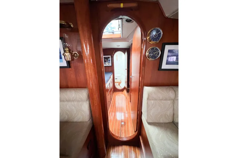 Slide: The Image of Interior of 1984 Trintella 42 yacht with polished wood and elegant decor. - 43