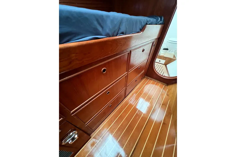 Slide: The Image of Polished wooden interior of 1984 Trintella 42 yacht with built-in storage drawers. - 45