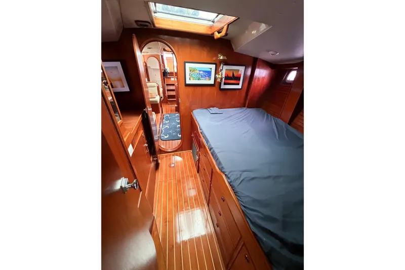 Slide: The Image of Interior of 1984 Trintella 42 yacht with wooden flooring and cozy cabin. - 46