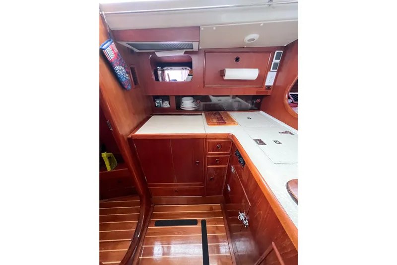 Slide: The Image of Interior of 1984 Trintella 42 yacht with wooden cabinetry and countertops. - 58