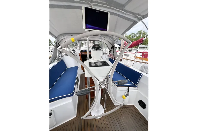 Slide: The Image of Cockpit of 1984 Trintella 42 sailboat with blue seating and steering wheel. - 67