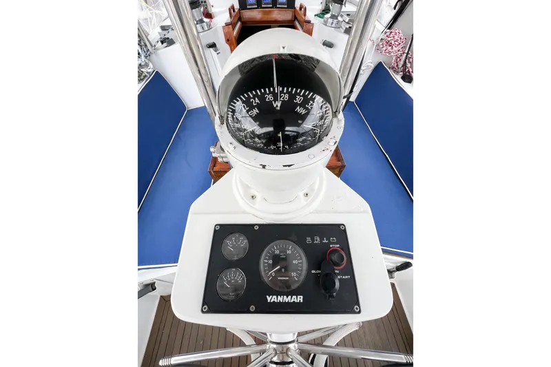 Slide: The Image of Cockpit of 1984 Trintella 42 sailboat with compass and Yanmar engine controls. - 68