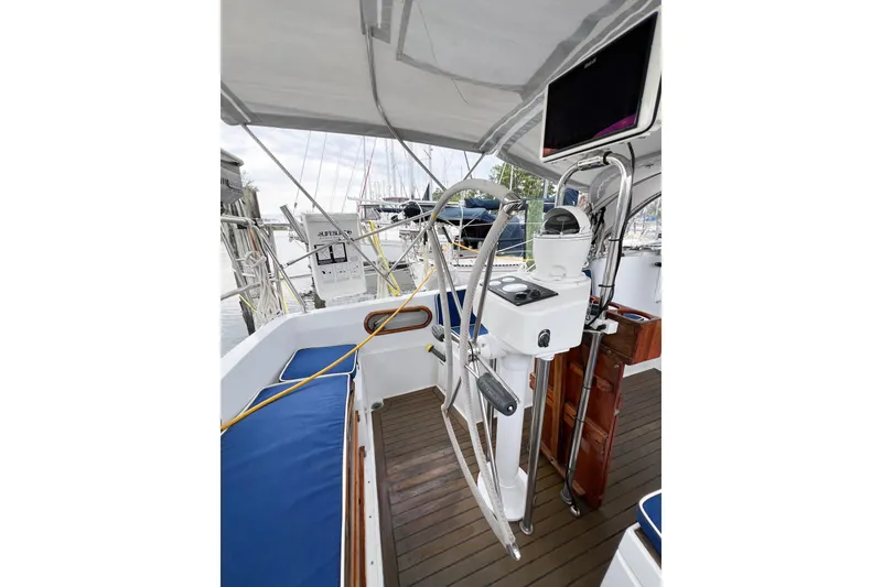 Slide: The Image of Cockpit of 1984 Trintella 42 sailboat with steering wheel and navigation equipment. - 70