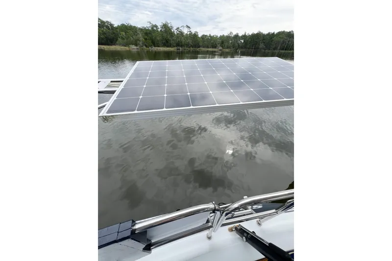 Slide: The Image of Trintella 42 sailboat with solar panel on calm water, 1984 model. - 71