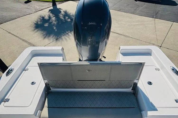 Slide: The Image of 2021 Sportsman Masters 227 Bay Boat with outboard motor and spacious deck layout. - 5