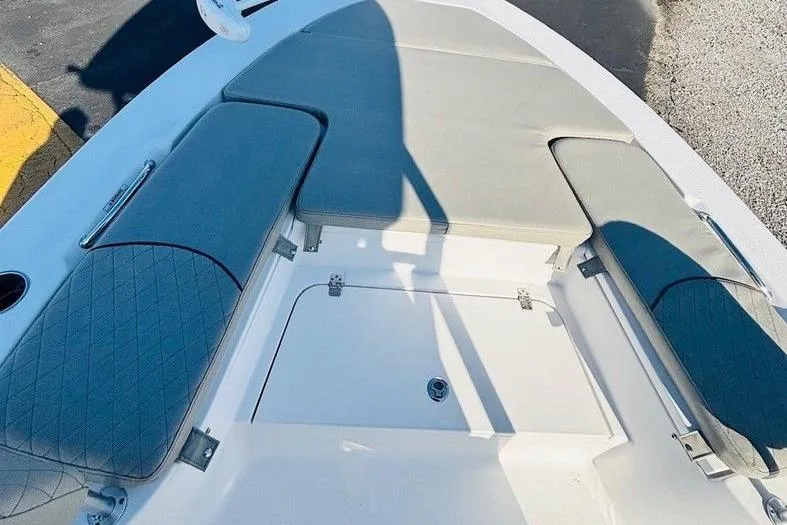 Slide: The Image of 2021 Sportsman Masters 227 Bay Boat interior seating and storage area. - 6