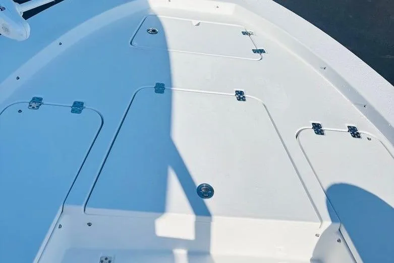 Slide: The Image of 2021 Sportsman Masters 227 Bay Boat deck with storage compartments and sleek design. - 7