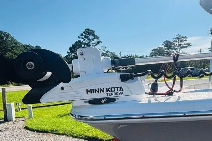 Slide: The Image of 2021 Sportsman Masters 227 Bay Boat with Minn Kota Terrova trolling motor in sunny outdoor setting. - 8