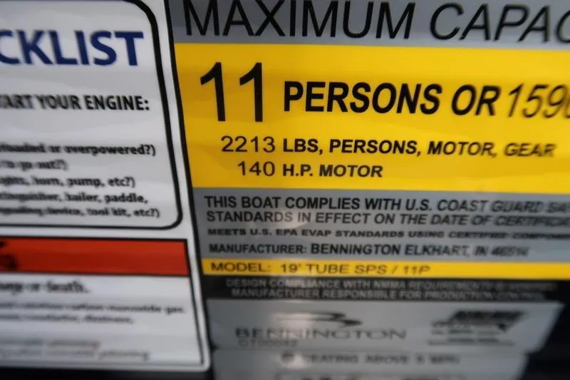 Slide: The Image of Maximum capacity label for Bennington S Quad Bench 20 SSR, 2026 model, 11 persons or 1593 lbs. - 14