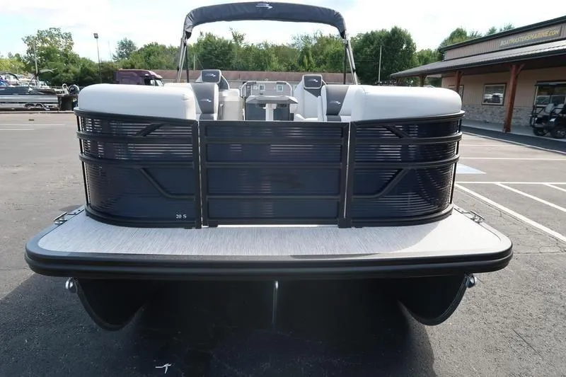Slide: The Image of 2026 Bennington S Quad Bench 20 SSR pontoon boat, front view in parking lot. - 2