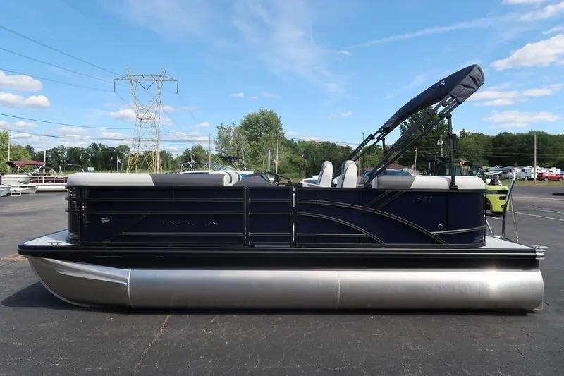 Slide: The Image of 2026 Bennington S Quad Bench 20 SSR pontoon boat on display outdoors. - 4