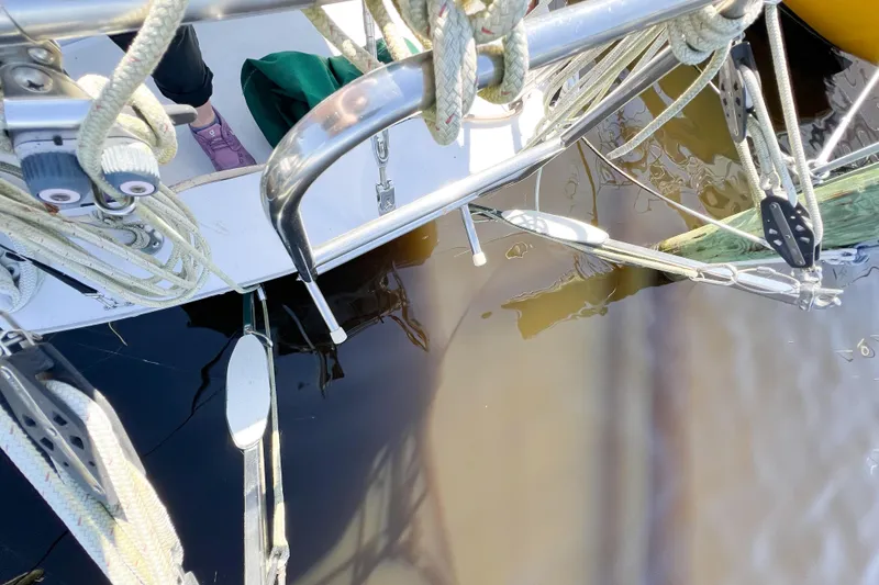 Slide: The Image of 1978 CAL 34 sailboat deck with rigging and water reflection. - 10
