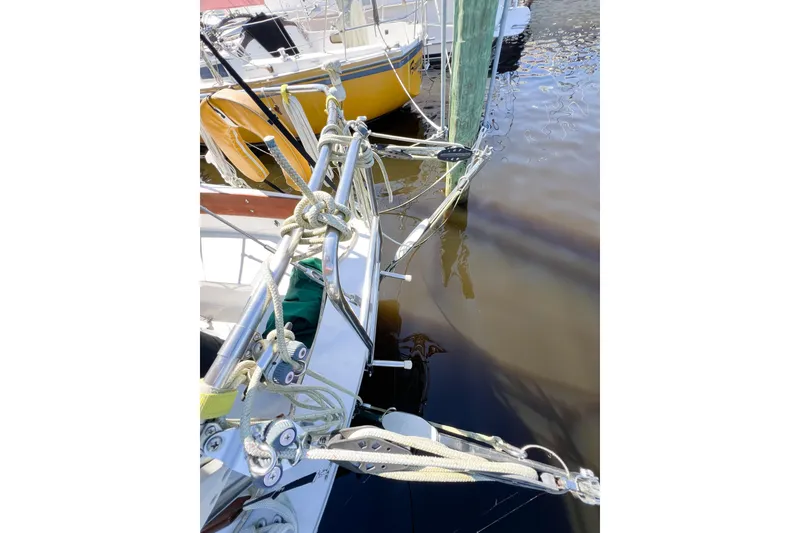 Slide: The Image of Close-up of a 1978 CAL 34 sailboat rigging and deck at a marina. - 11