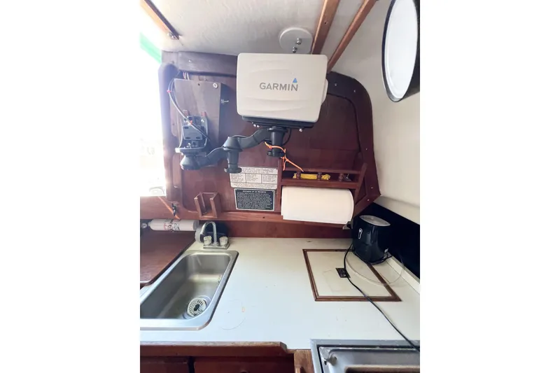 Slide: The Image of Interior of a 1978 CAL 34 sailboat with Garmin navigation equipment. - 34