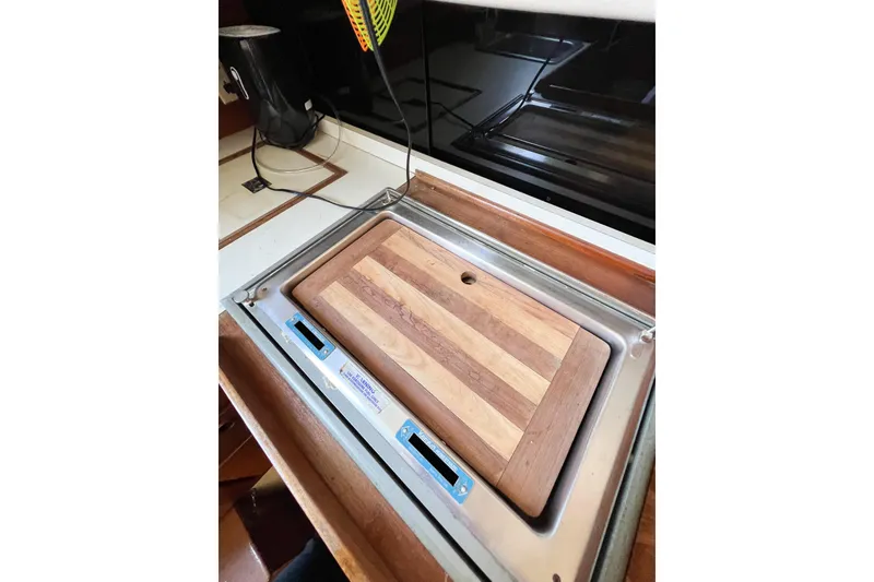 Slide: The Image of Wooden cutting board on a CAL 34 sailboat kitchen counter, 1978 model. - 35
