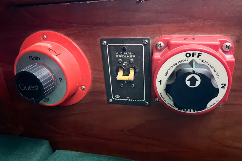 Slide: The Image of Control panel of a 1978 CAL 34 boat with switches and dials. - 38