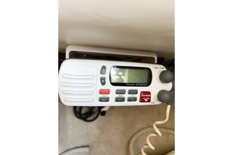 Slide: The Image of VHF marine radio on a 1978 CAL 34 sailboat, featuring distress and communication controls. - 41