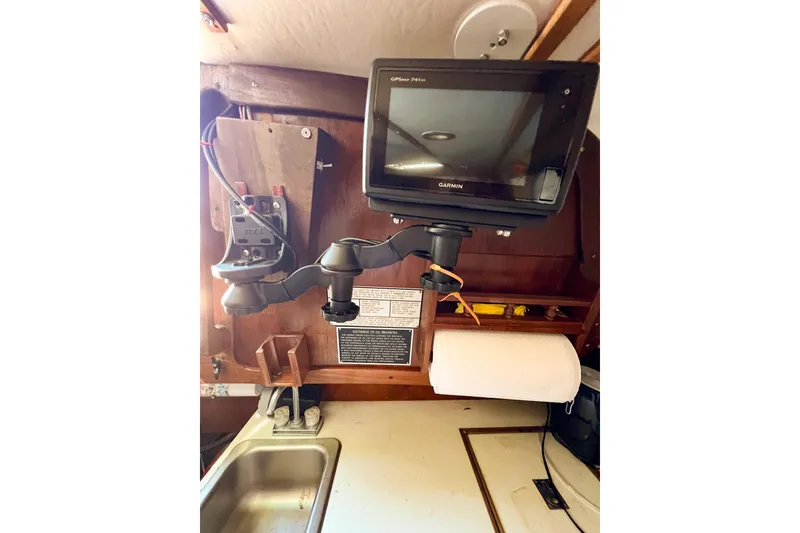 Slide: The Image of Garmin GPS mounted in 1978 CAL 34 sailboat kitchen area. - 43
