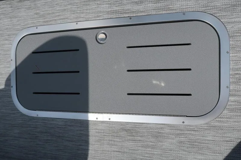 Slide: The Image of 2026 Bennington S Quad Bench 22 SSR boat seating in a parking lot. - 11