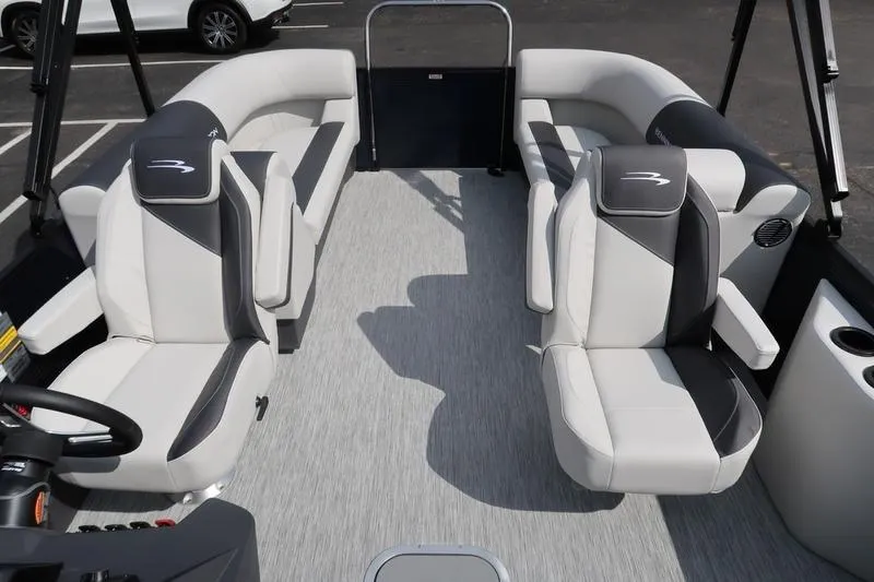 Slide: The Image of Steering console of 2026 Bennington S Quad Bench 22 SSR with gauges and controls. - 21