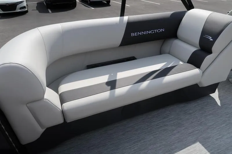 Slide: The Image of 2026 Bennington S Quad Bench 22 SSR boat seating, featuring sleek gray and black upholstery. - 26