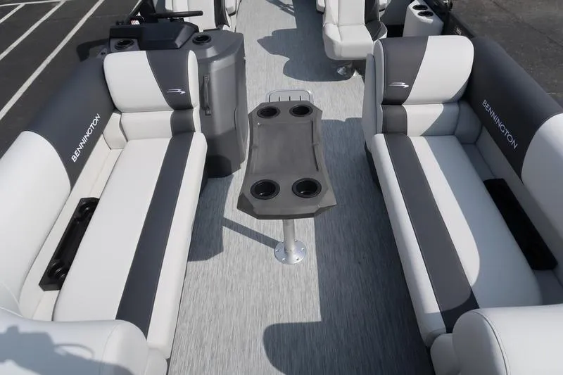 Slide: The Image of 2026 Bennington S Quad Bench 22 SSR pontoon boat, docked outdoors. - 5