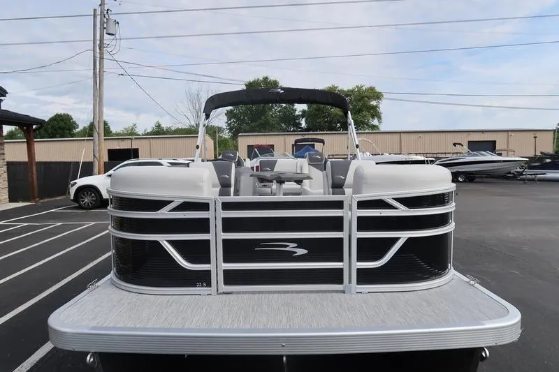 The Image of 2026 Bennington S Swingback 22 SSB pontoon boat in a modern showroom. - 1