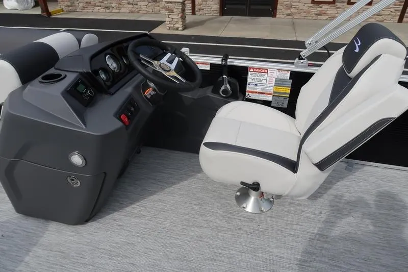 Slide: The Image of 2026 Bennington S Swingback 22 SSB boat interior with steering console and captain's chair. - 13