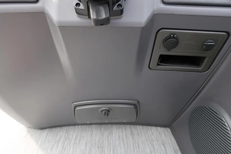 Slide: The Image of 2026 Bennington S Swingback 22 SSB boat seat with cup holders in a parking lot. - 18