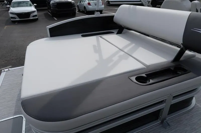 Slide: The Image of 2026 Bennington S Swingback 22 SSB dashboard with control panel and speaker. - 21