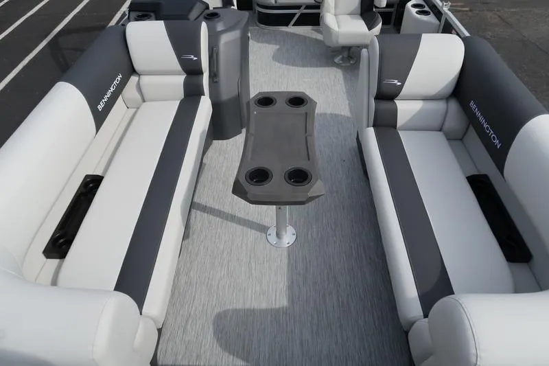 Slide: The Image of 2026 Bennington S Swingback 22 SSB pontoon boat interior with gray seating and table. - 5